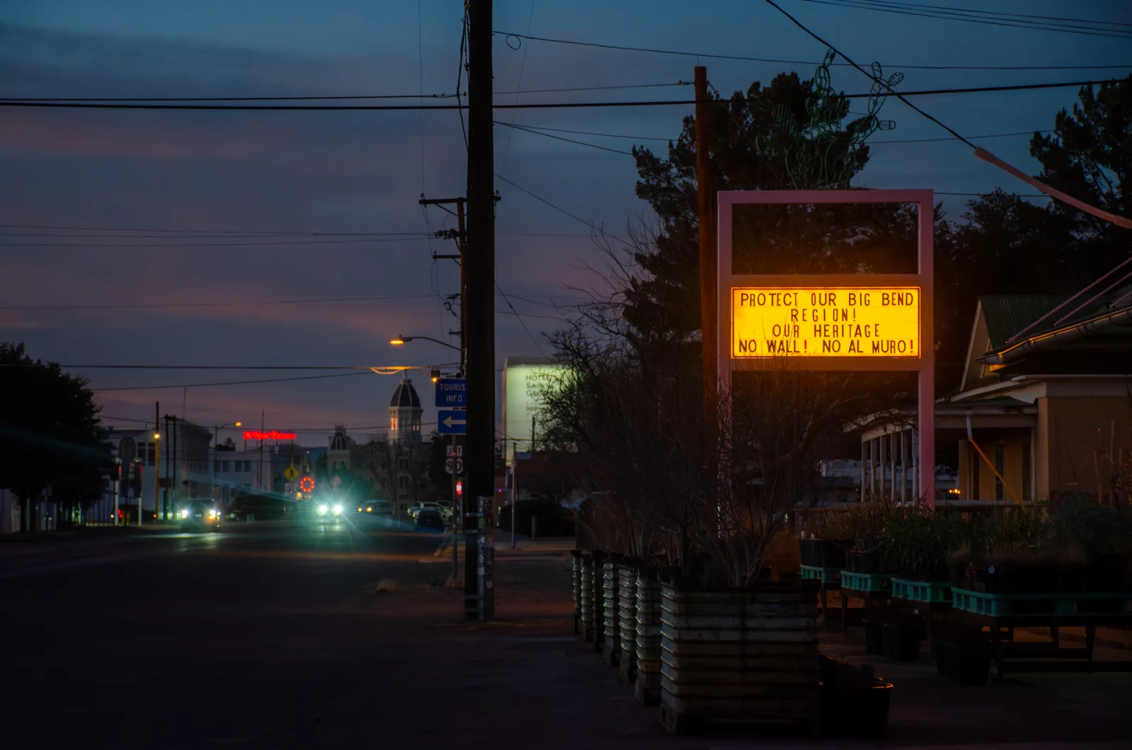 Across the Big Bend, anti-wall signs, flyers and messages have popped up in homes and businesses, like this liquor store in Marfa, Texas. Carlos Morales