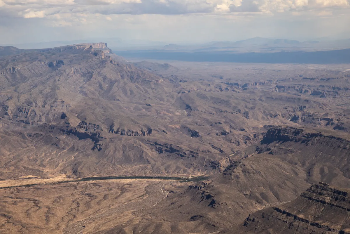 The Rio Grande cuts through the desert between the U.S. and Mexico as seen from an aerial view over Big Bend National Park on May 24, 2026. Kaylee Greenlee for The Texas Tribune