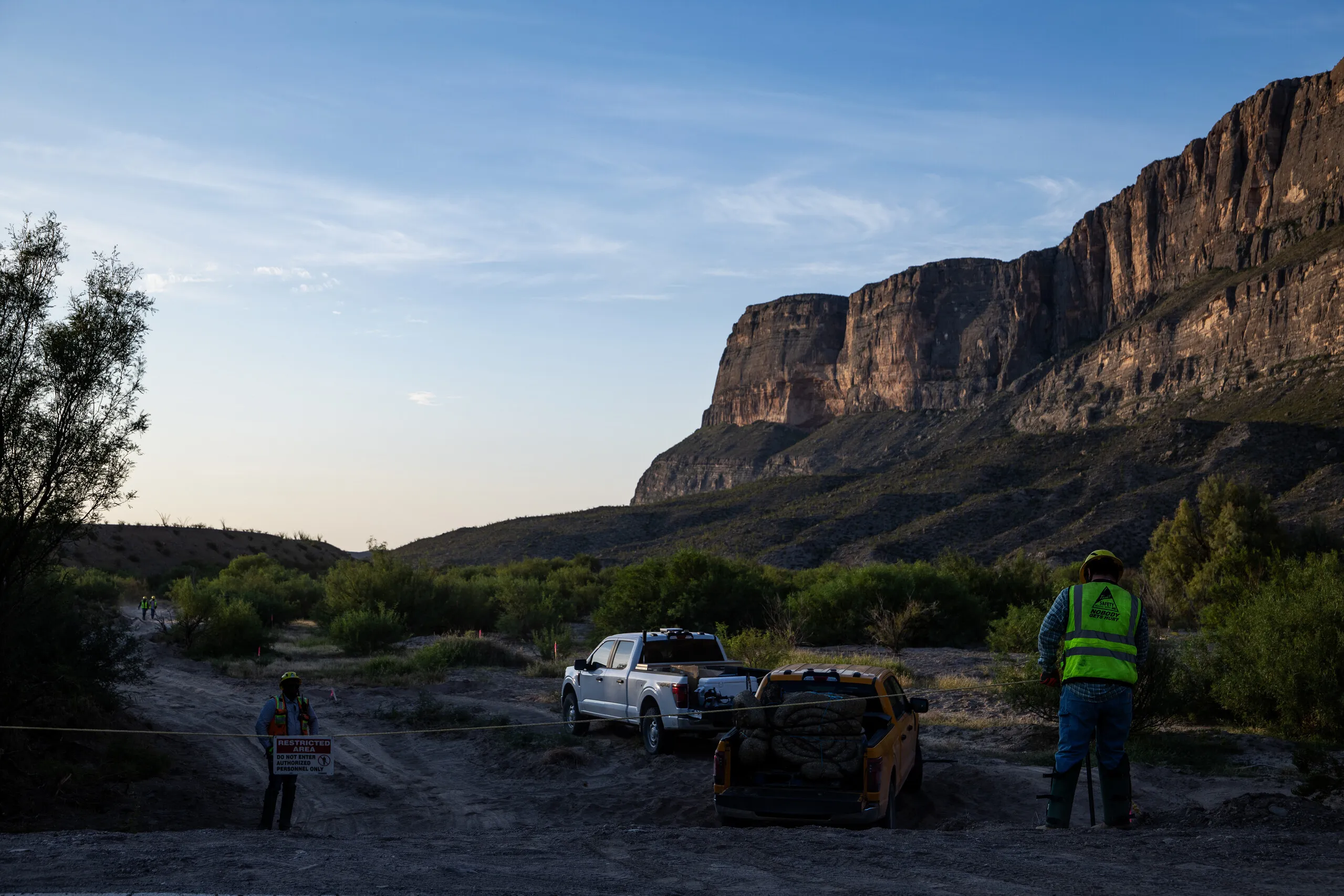 Southwest Valley employees install T posts and rope along a leveled river access area off Ross Maxwell Scenic Drive in Big Bend National Park on Aug. 13, 2026. Kaylee Greenlee for The Texas Tribune