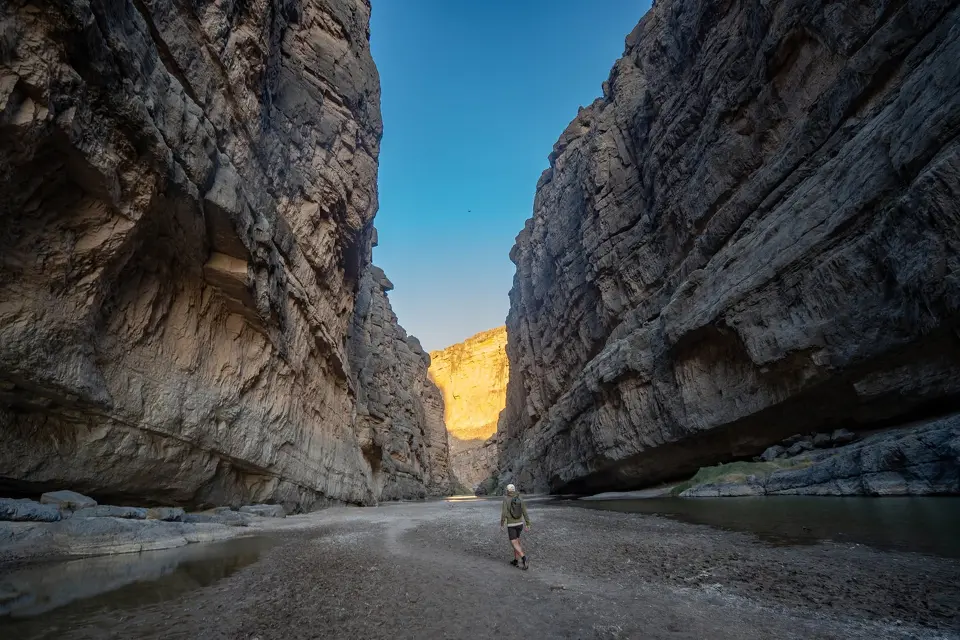 Charlie Gandy hikes last year into Santa Elena Canyon at Big Bend National Park. Recent construction work in the park threatens one of the wildest, darkest and quietest places in the lower 48 states, Pam LeBlanc writes.