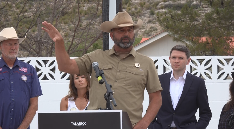 Terrell County Sheriff Thaddeus Cleveland speaking at podium, James Talarico (right)
