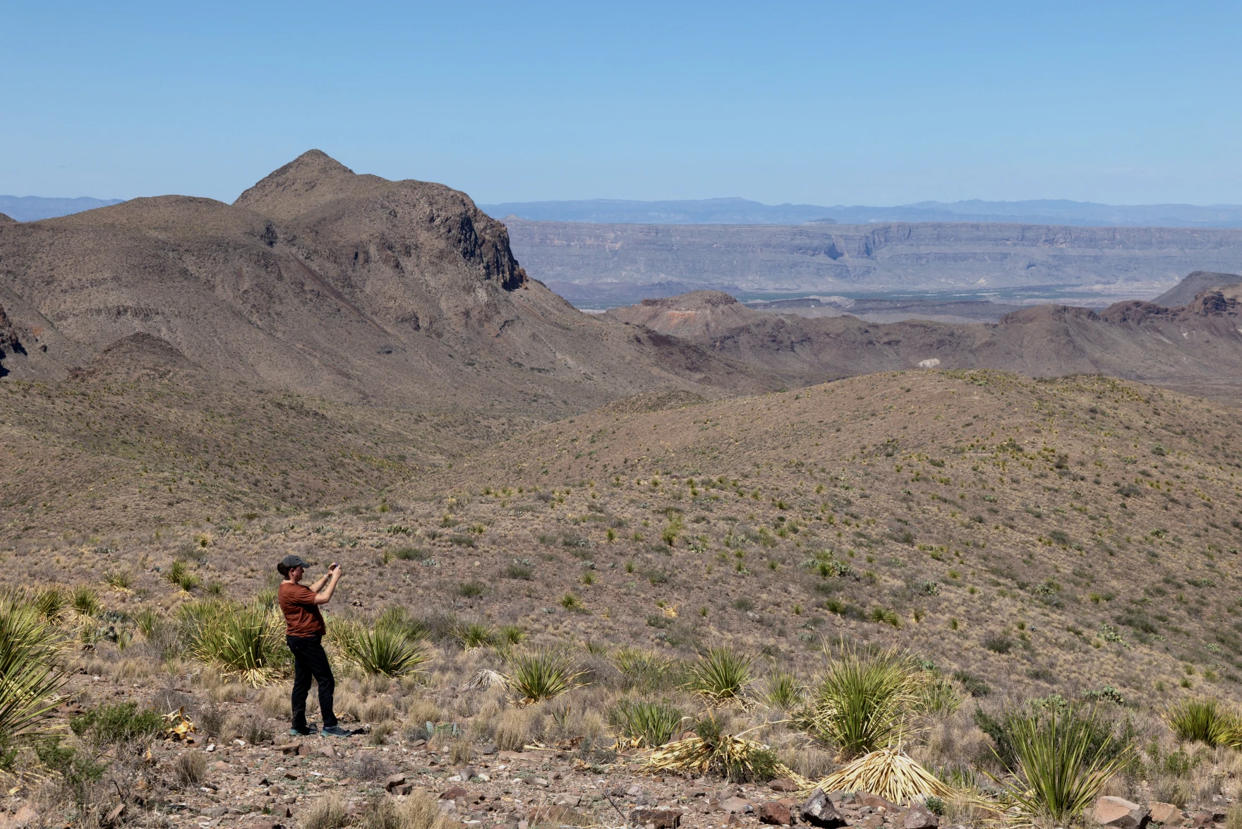 FILE PHOTO: Jennifer Swartz, who traveled from Fort Worth, Texas, U.S. to visit Big Bend National Park, stands in the park in Texas, U.S. June 21, 2025. REUTERS/Kaylee Greenlee/File Photo