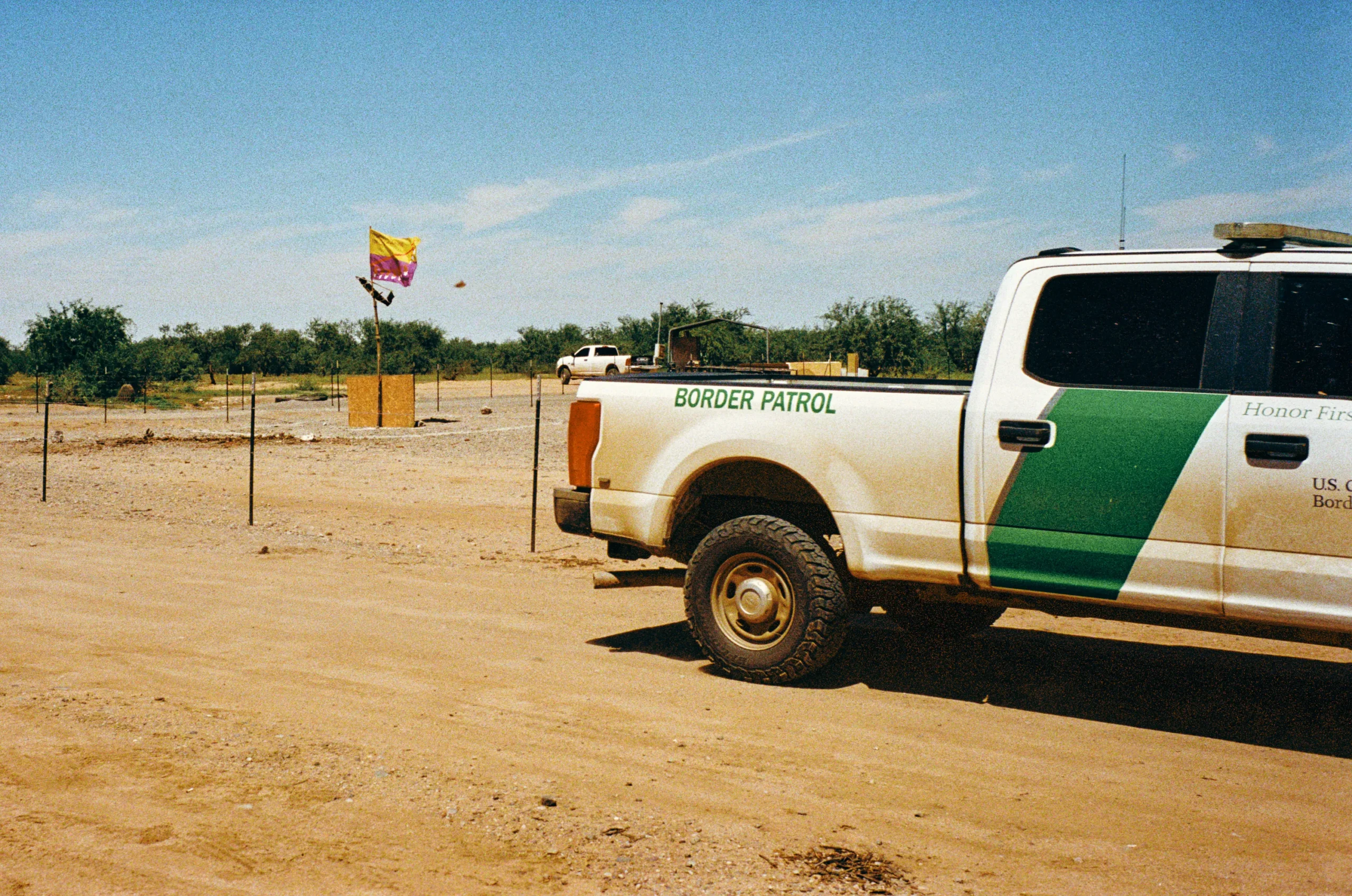 A border patrol vehicle drives past the Tadai Me:i prayer camp on the Tohono O’odham nation on Sept. 5. Cam Mackey